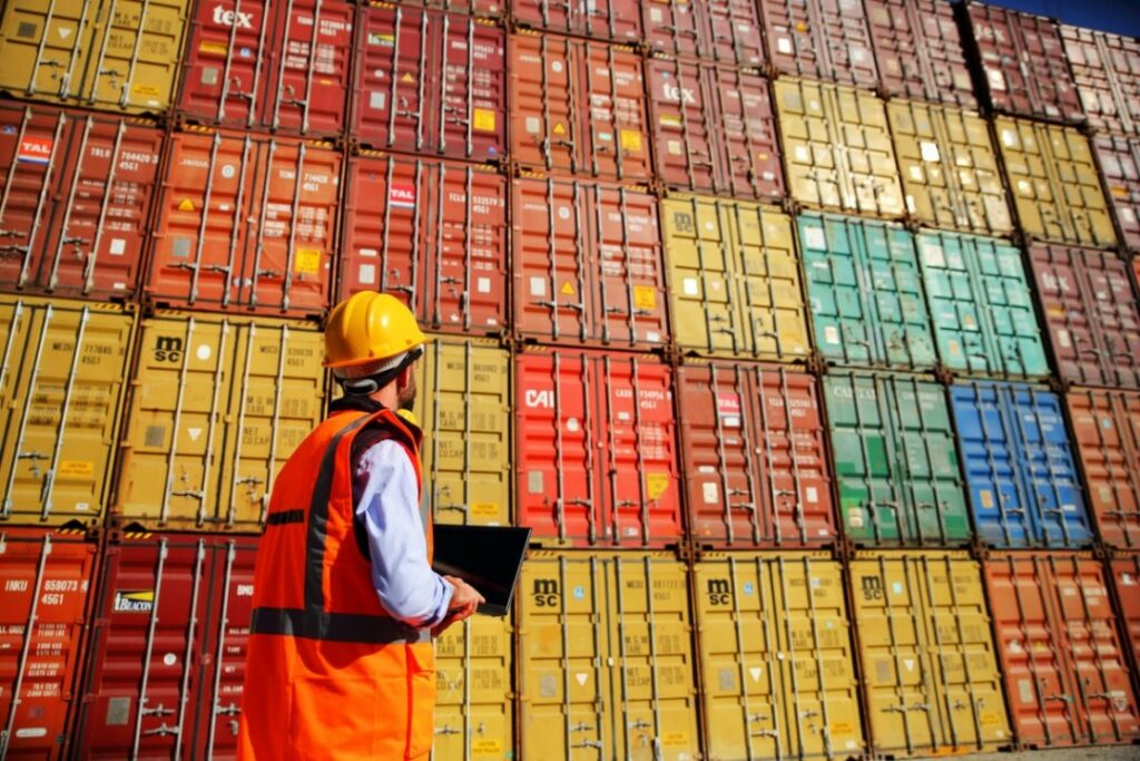 A man inspecting containers